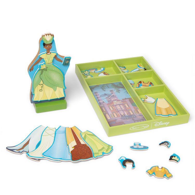 The loose pieces of The Melissa & Doug Disney Princess Tiana Magnetic Dress-Up Wooden Doll Pretend Play Set (30+ pcs)
