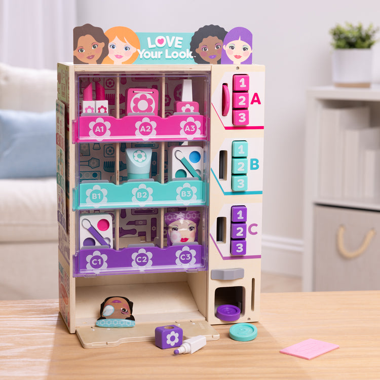 A playroom scene with The Melissa & Doug Sort, Stock, Select Beauty Kiosk Vending Machine Play Set, Pretend Makeup Wooden Toy For Boys and For Girls 3+