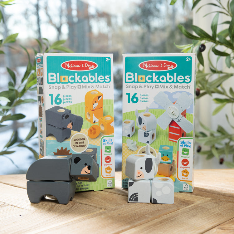 A playroom scene with The Melissa & Doug Blockables™ Farm and Woodland 2-Pack Bundle Connectable Wooden Building Blocks Preschool Play Set Toy 
