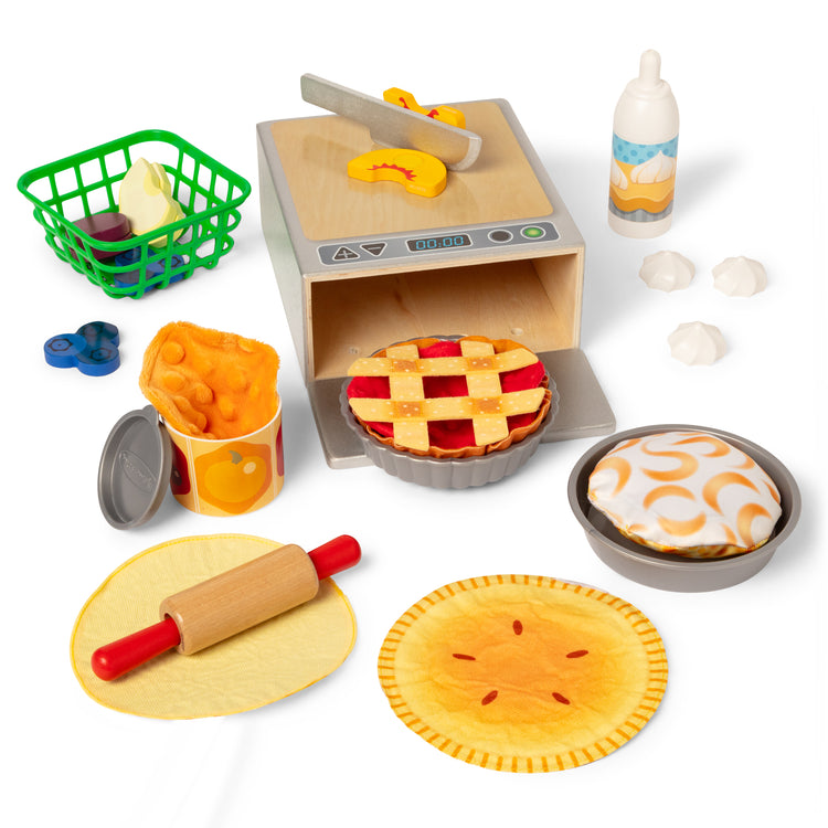 The loose pieces of The Melissa & Doug Make and Bake Pies Pretend Play Food Set And Wooden Oven With Squishy Dough for Ages 3+
