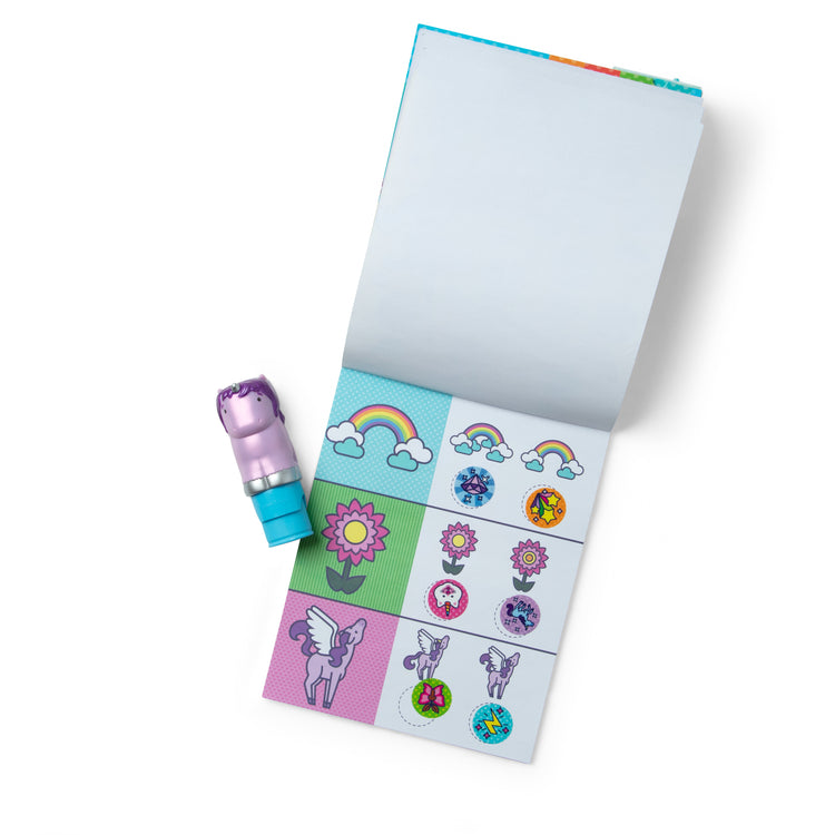 The loose pieces of The Melissa & Doug Sticker WOW!™ 24-Page Activity Pad and Sticker Stamper, 300 Stickers, Arts and Crafts Fidget Toy Collectible Character – Sprinkles the Purple Unicorn