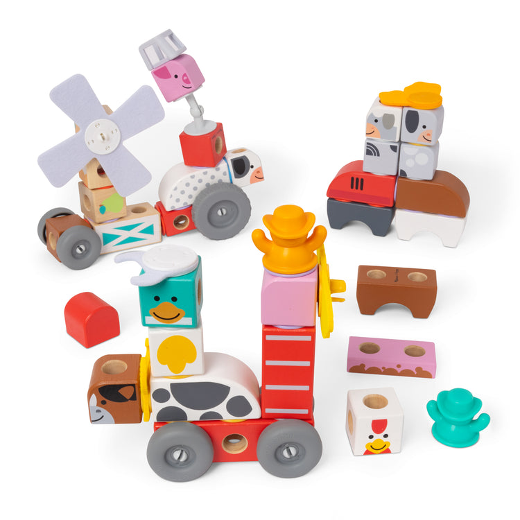 The loose pieces of The Melissa & Doug Blockables™ Farm and Farm Friends 2-Pack Bundle Connectable Wooden Building Blocks Preschool Play Set Toy