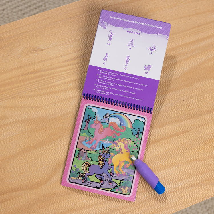 A playroom scene with The Melissa & Doug Water WOW! Reusable Water-Reveal Coloring Activity Pad Travel Toy – Unicorn