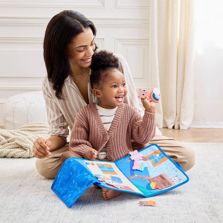 The loose pieces of The Melissa & Doug® Ms. Rachel™ What to Wear Felt Activity Board Take-Along Preschool Learning Toy for Boys and Girls