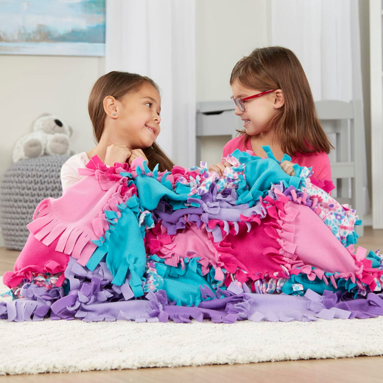 The front of the box for the Melissa & Doug Created by Me! Flower Fleece Quilt No-Sew Craft Kit (48 squares, 4 feet x 5 feet)