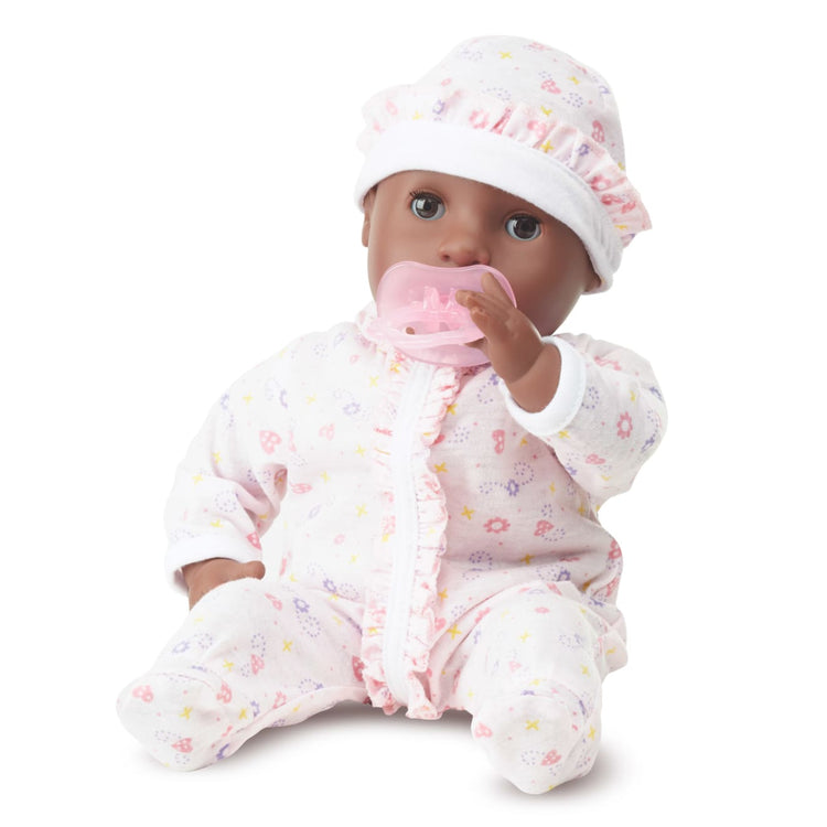 The loose pieces of the Melissa & Doug Mine to Love Gabrielle 12" Poseable Baby Doll With Romper, Hat, Pacifier